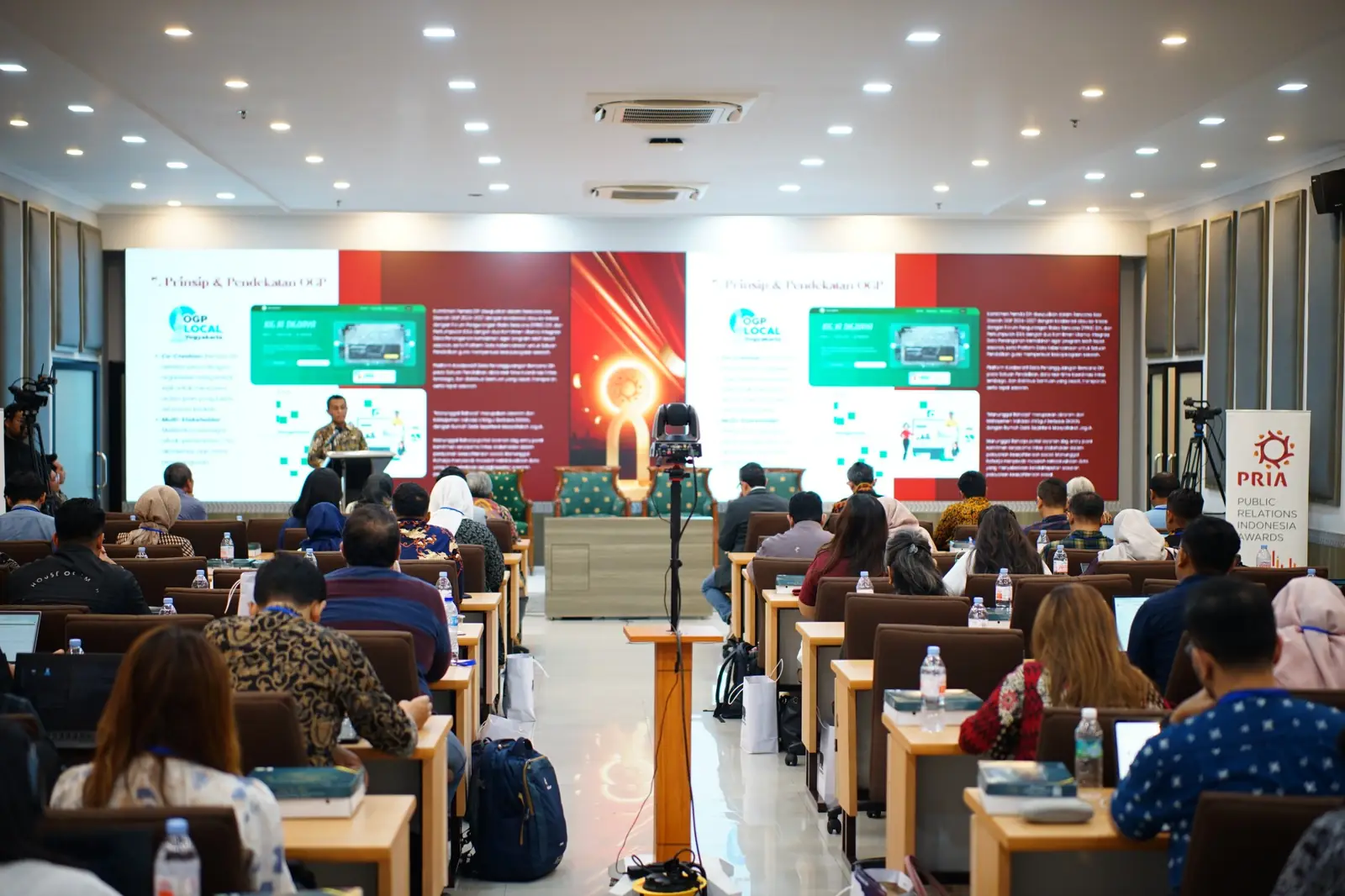 Delegates listening to a presentation at a PR INDONESIA conference